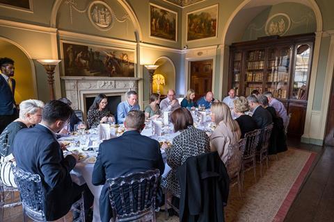 18 people gather around a large oval table at Portman Square’s Home House in London - the roundtable attendees are enjoying a hearty meal while discussing insurance fraud.